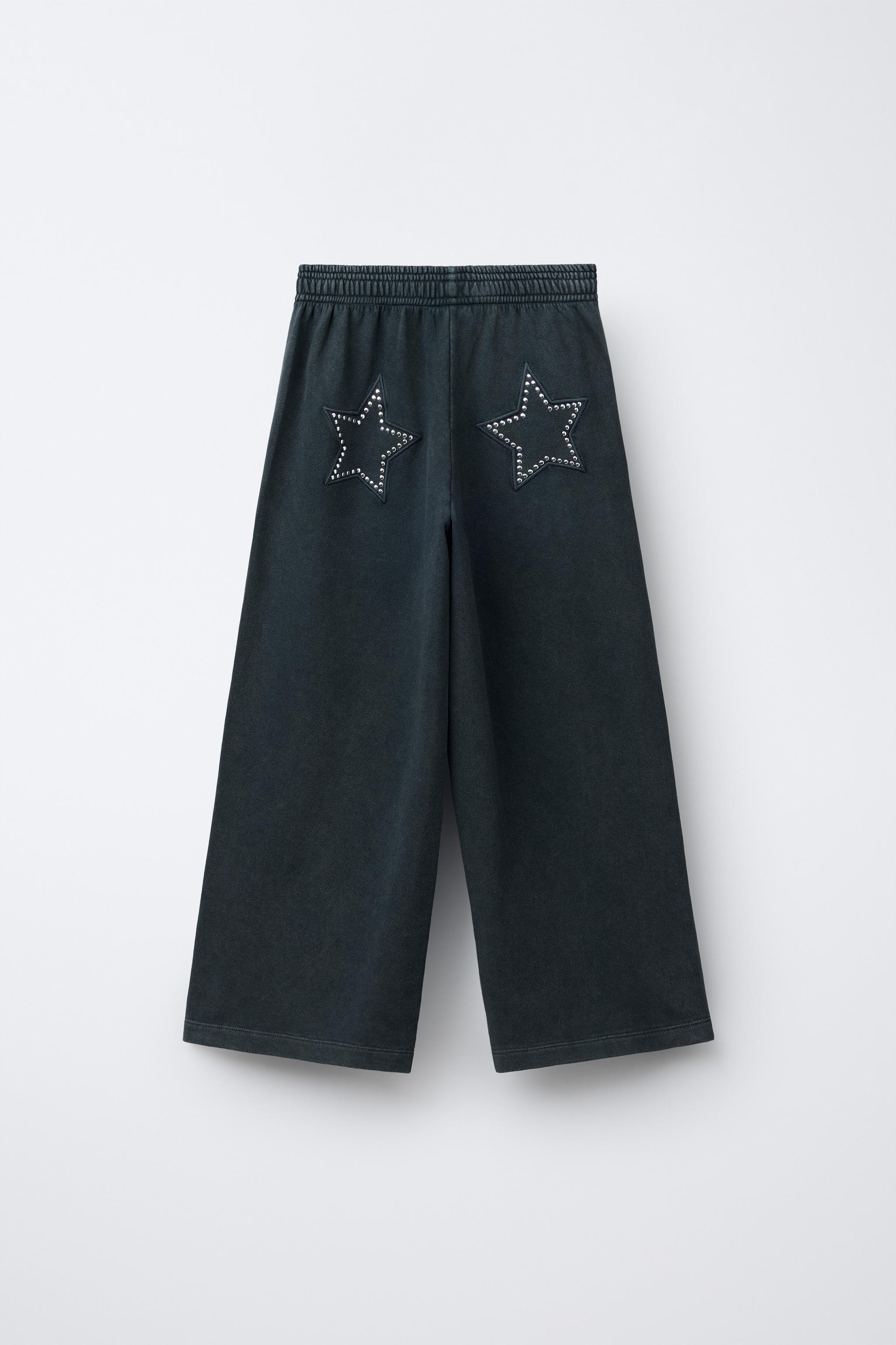 WASHED EFFECT WIDE LEG PANTS WITH STARS AND STUDS